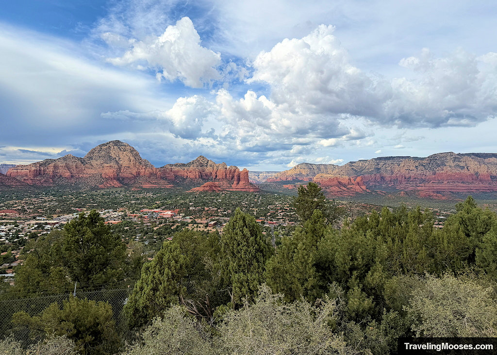 Wide elevated panoramic vista of West Sedona, lush green valley